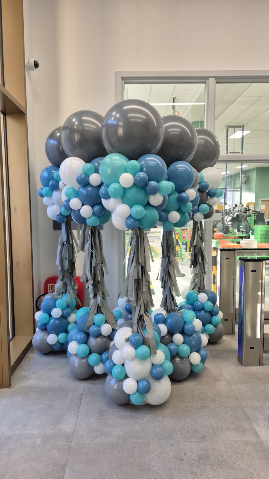 Tall organic balloon towers in teal blue white and grey