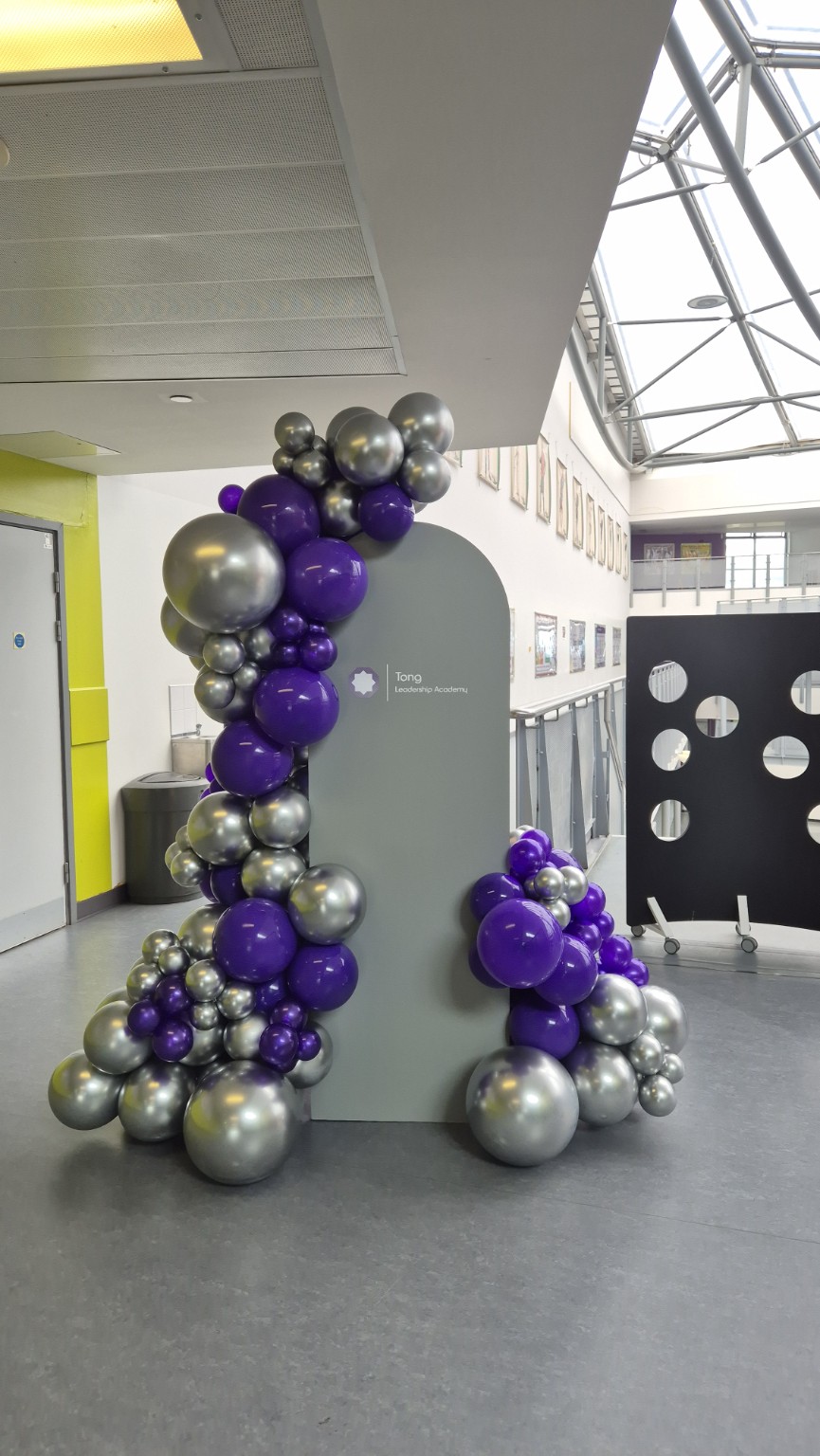 Single branded school backboard with purple and silver balloons