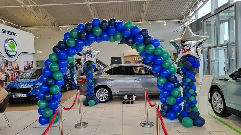 Indoor balloon arch in a car showroom