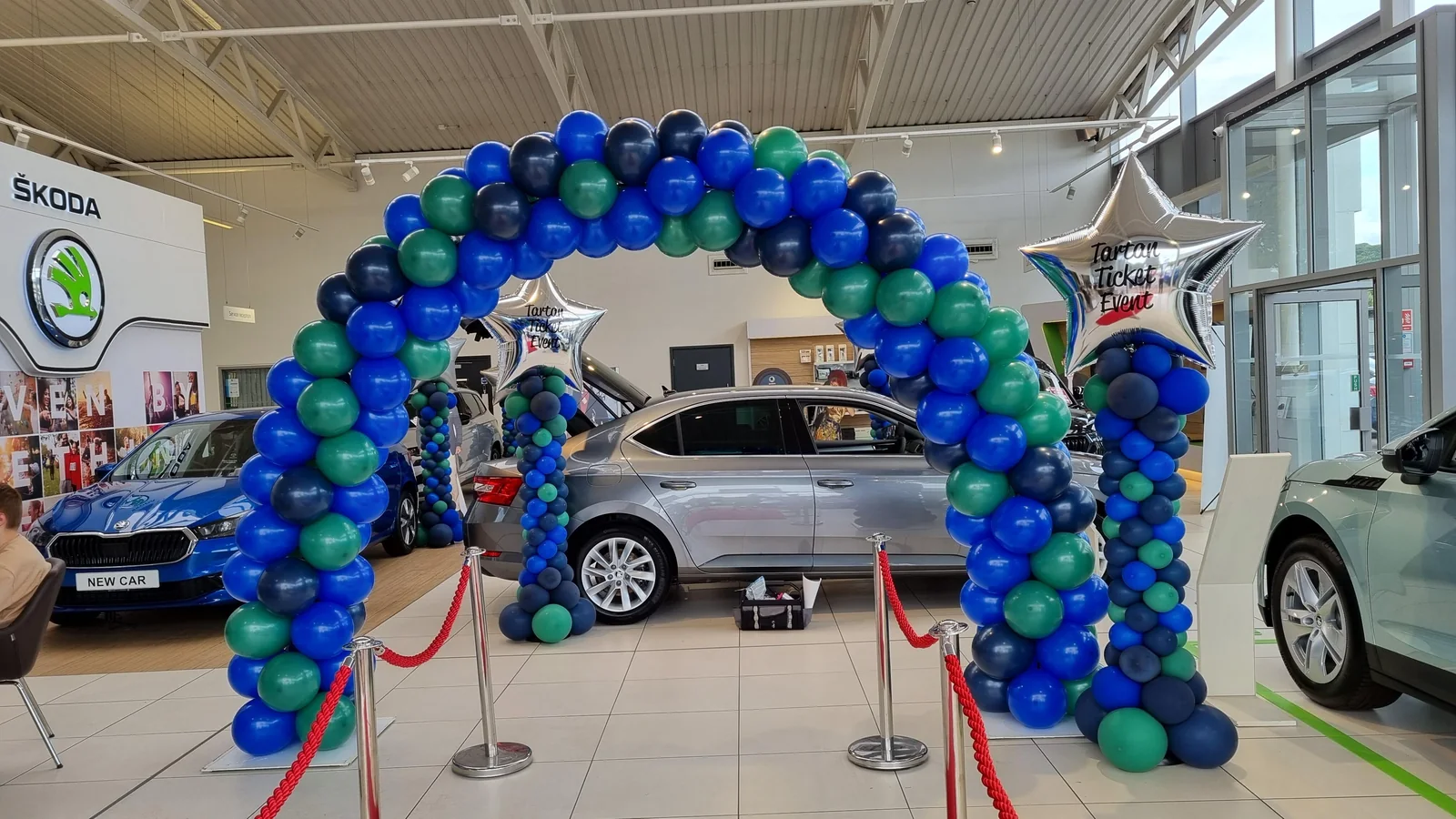 Indoor balloon arch in a car showroom