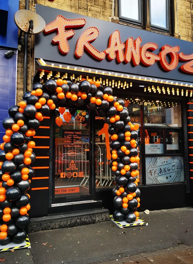 Organic balloon arch professionally installed around a single entrance